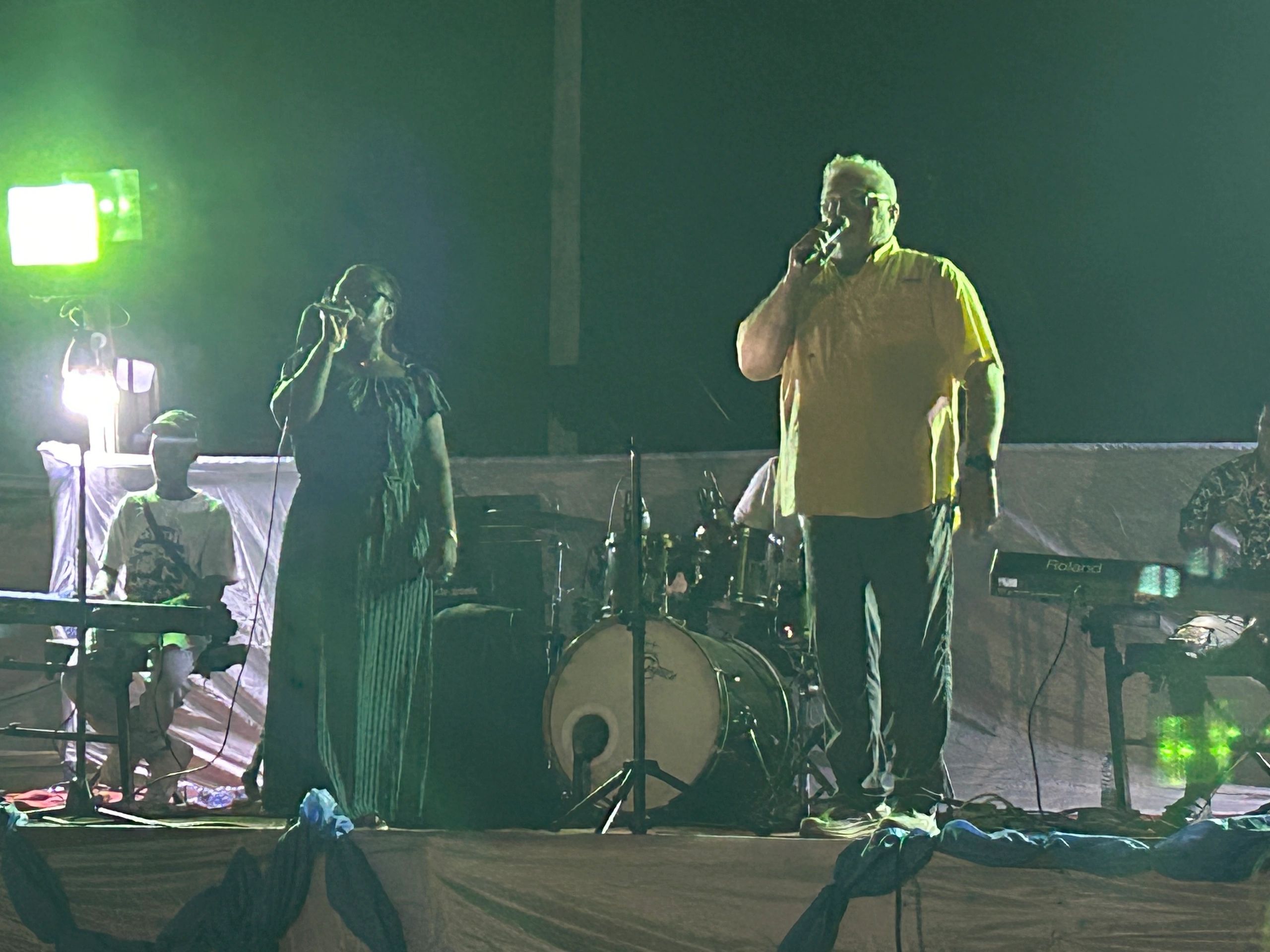 Mike and Jaida ministering on stage at an evening crusade